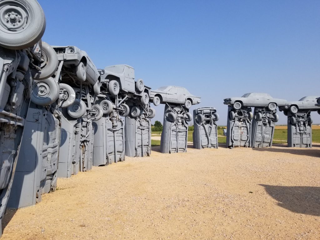 A close up image of the vehicles of Carhenge.